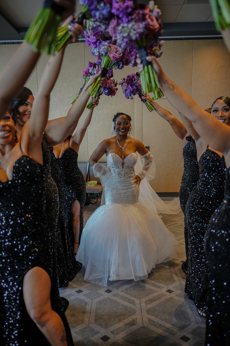 Story post: bridesmaids raising bouquets over the bride
